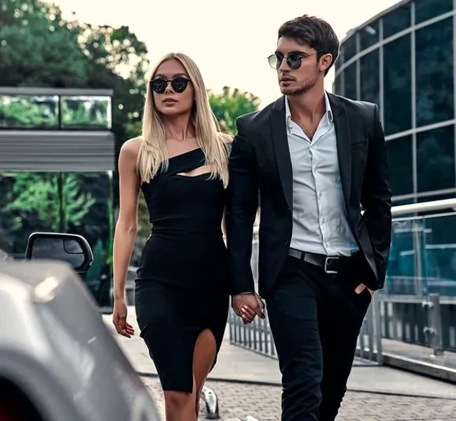 An escort lady with her client on the way to the date
