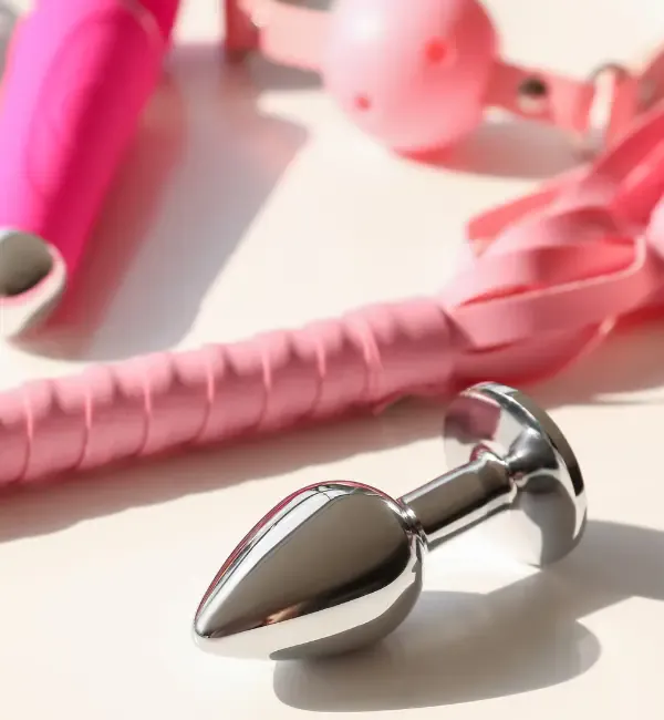 Anal plug next to other erotic toys