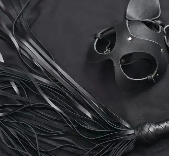 Leather mask and whip for spanking sex