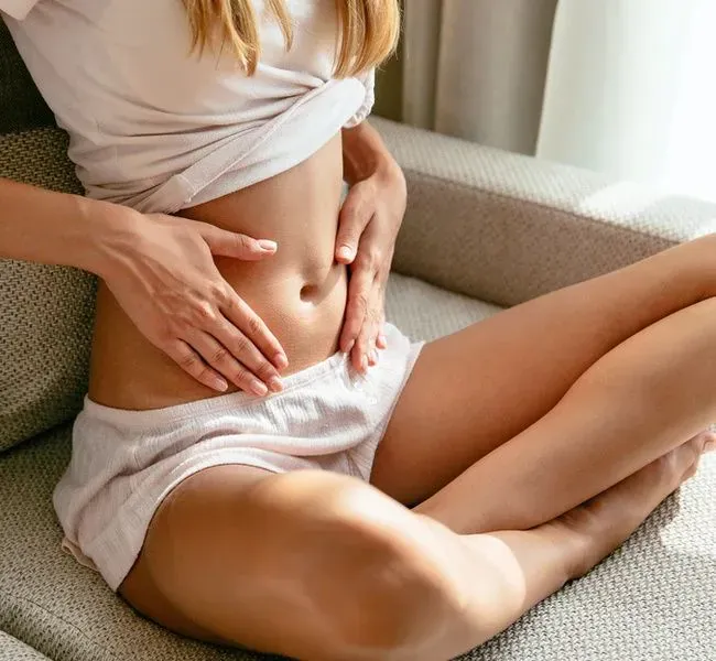 woman touching her belly