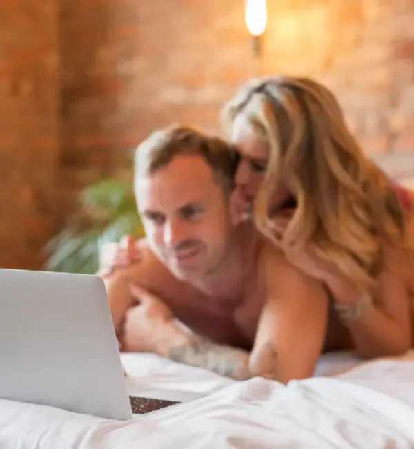 A couple watches porn during sex